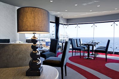 MSC Divina; Fantasia Class; Ship; Inside; Restaurant; Public areas; Galaxy Disco & Restaurant; Table; Chair; Sea; Window;